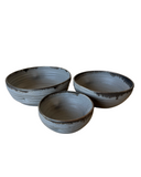 Three gray bowls on a white background