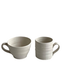 Two ceramic mugs on a white background