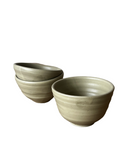 Two ceramic bowls on a white background