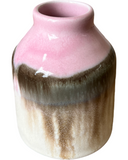 Ceramic vase with pink and brown gradient on a white background