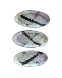 Two oval-shaped ceramic trays with a speckled beige and white glaze finish. One is small and the other is medium-sized.