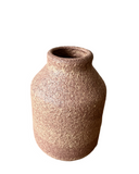 A warm pink with hints of beige porcelain vase with a frothy, bubbly glaze.