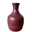 Red-brown ceramic vase on a white background