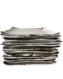 Stack of square plates on a white background.