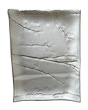 White ceramic tray with leaf pattern on a white background