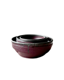 Set of three ceramic bowls with a purple glaze on a white background