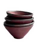 A stack of five round ceramic mini dip bowls with a speckled glaze in shades of gray and bronze.