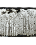 Close-up of a textured white surface with black specks and patterns