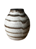 A collection of four ceramic vases, with the Luna Striped Vase in the foreground. The vases are crafted from brown stoneware clay with striped patterns in various shades of bronze.