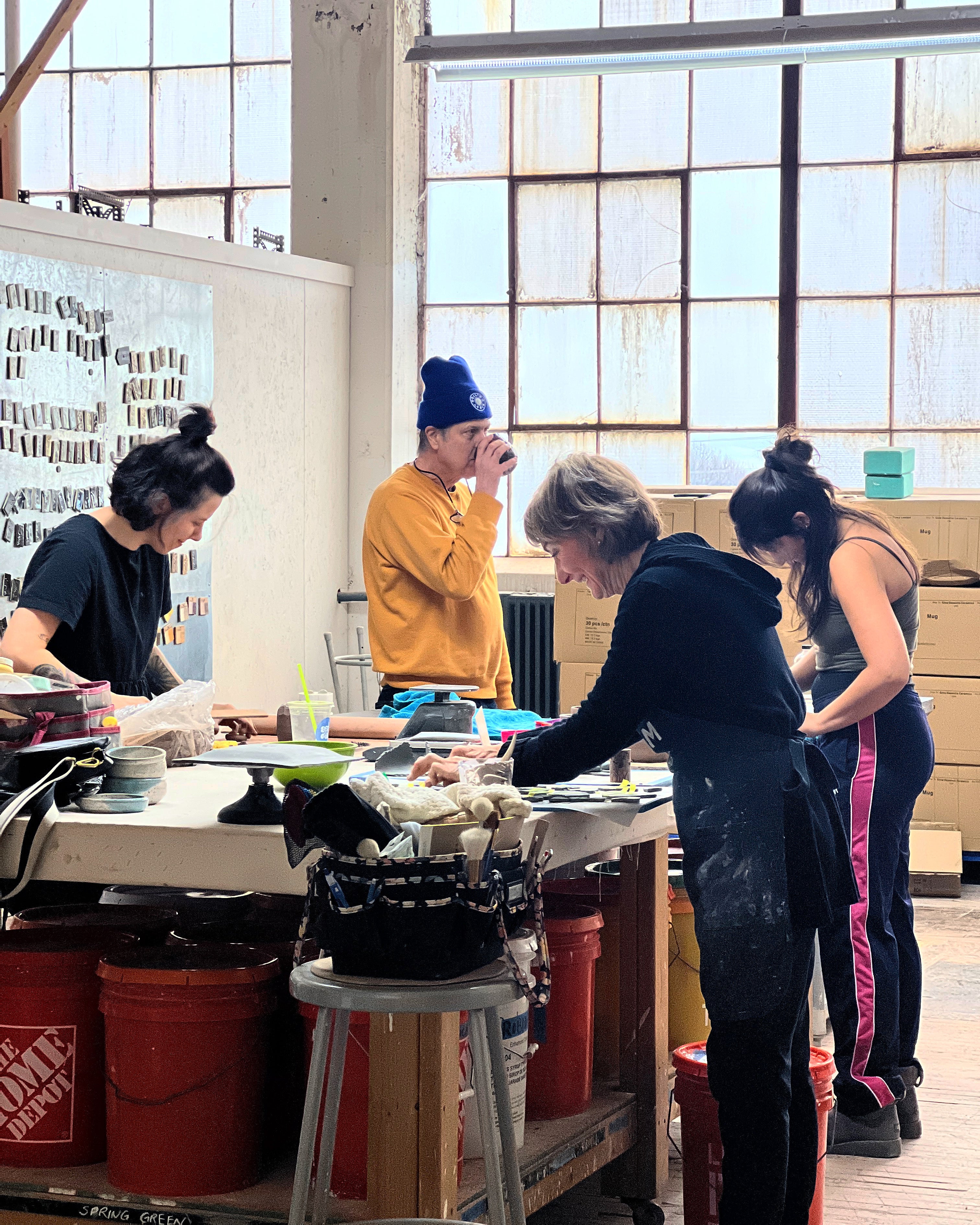 Ceramic studio members at work.