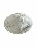 Decorative leaf-shaped plate on a white background