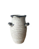 vase with handles in bronze and beige on a white background 