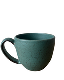 Teal ceramic mug on a white background