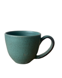Green ceramic mug on a white background