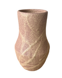 A warm pink with hints of beige porcelain vase with a frothy, bubbly glaze.