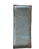 Rectangular ceramic tile with textured surface on a white background