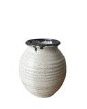 Beige and bronze vase on a white background 