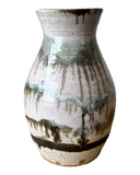 Ceramic vase with a textured surface on a white background