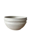 Beige bowl on a white background 