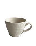 Beige ceramic mug on a white background