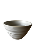 Gray ceramic bowl on a white background