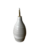 White ceramic vase with a gold accent on a white background