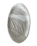Decorative stone with leaf pattern on a white background