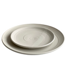 Two beige ceramic plates stacked on a white background